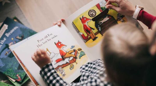 Young boy reading a book