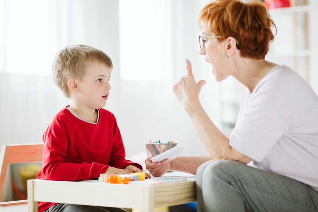 Speech therapy teacher with student
