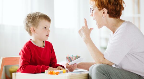 Speech therapy teacher with student