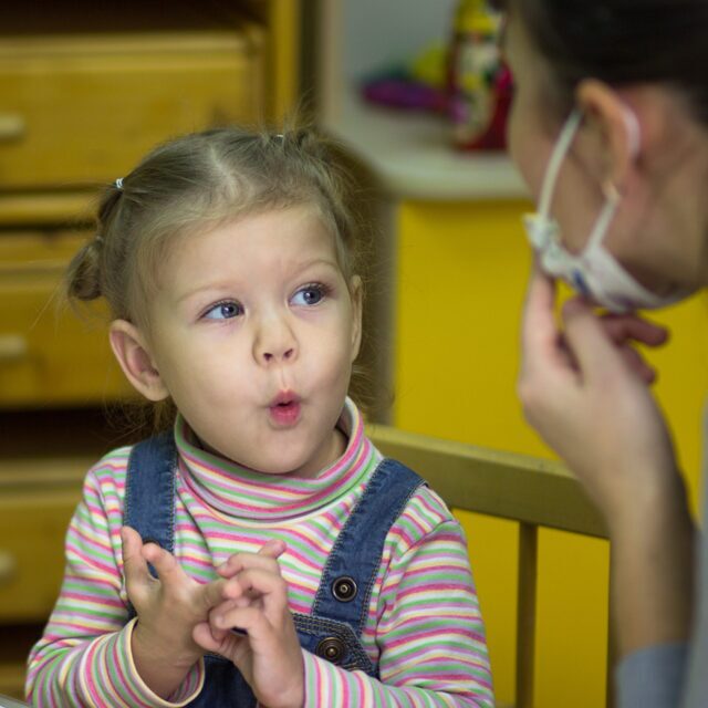 Speech therapy session with a therapist and child