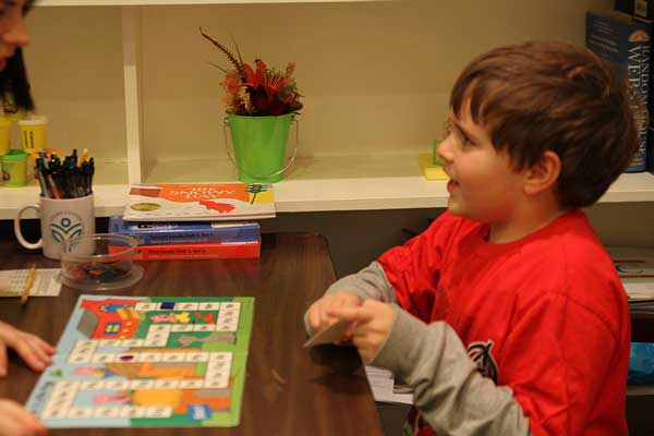 Young boy looking at teacher