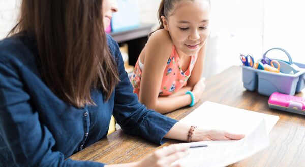teacher with young girl student