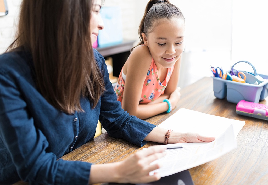 teacher with young girl student