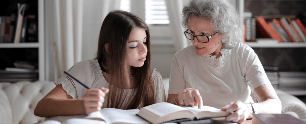 teacher with girl teen learning