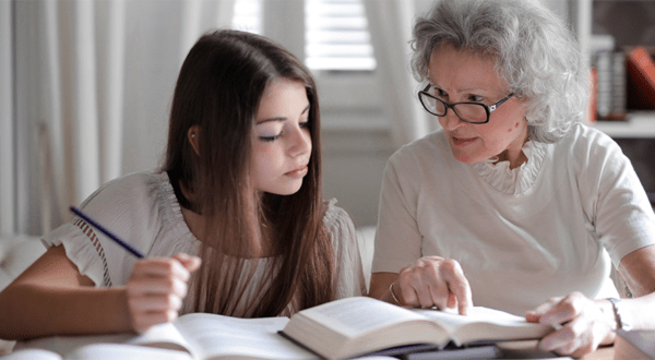 teacher with girl teen learning