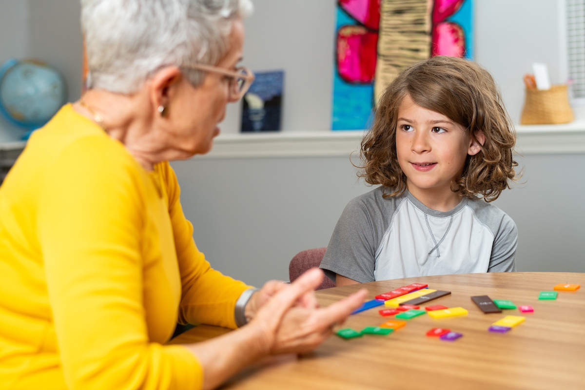 An instructor teaches a student a multisensory math lesson