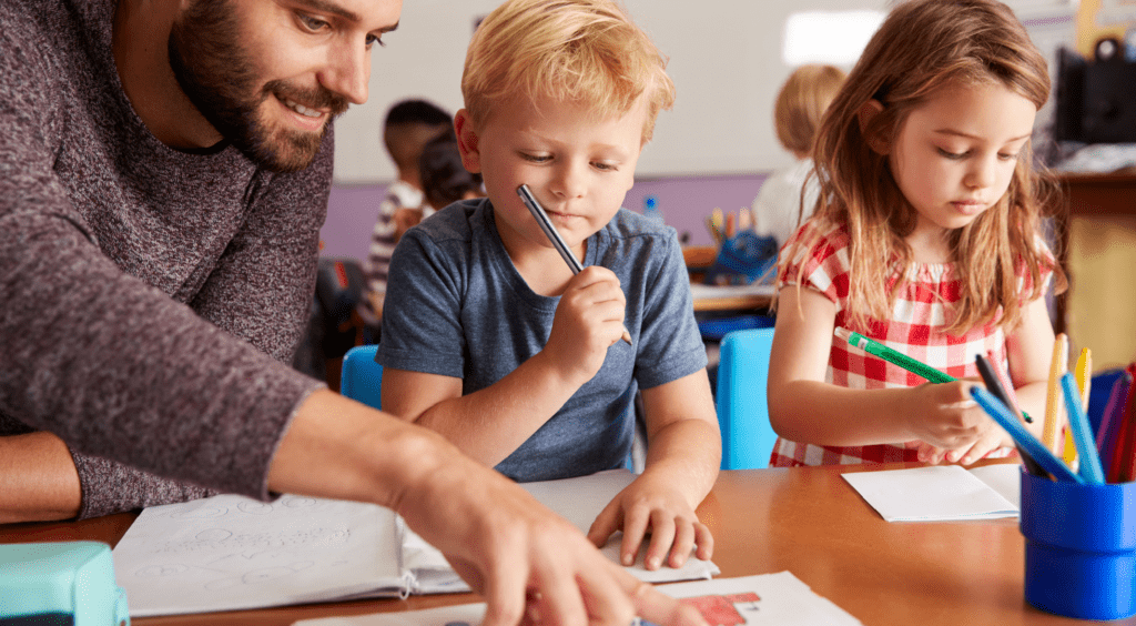 Teacher working with students