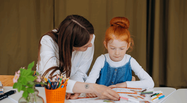 teacher with young girl studnet