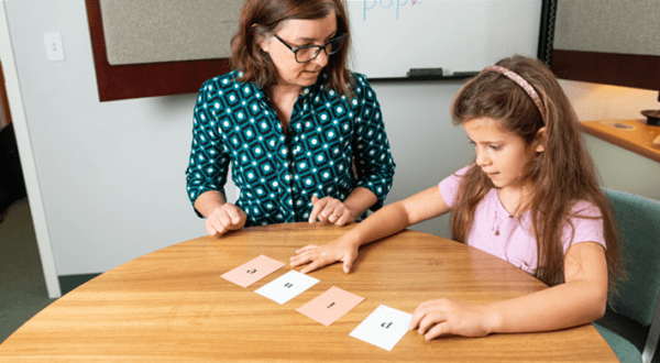 teacher-working-with-girl