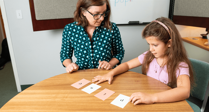 teacher-working-with-girl