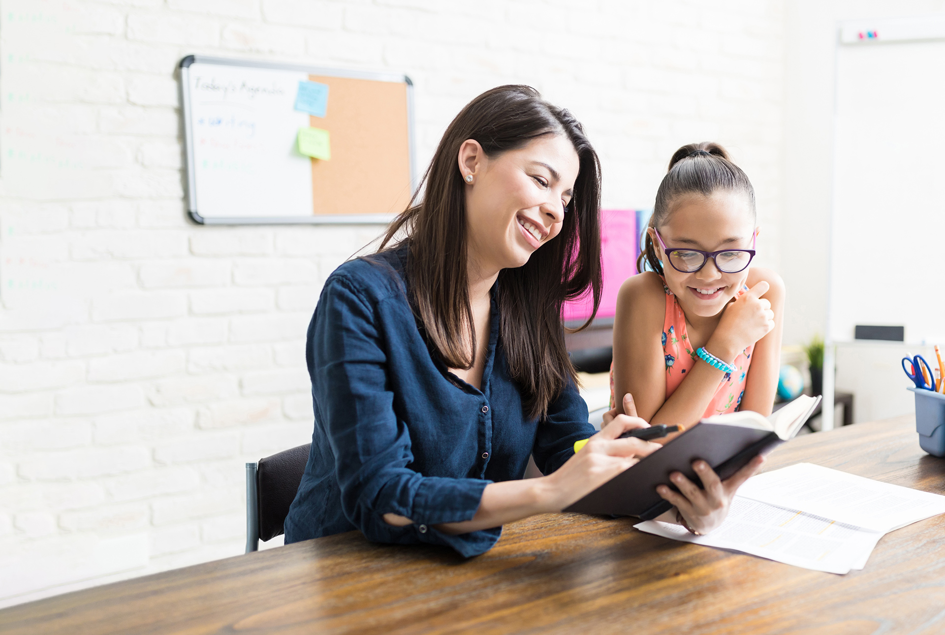 Reading teacher instructing student