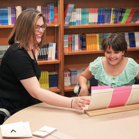 A student practices blending the sounds in words with an Orton-Gillingham trained reading interventionist.