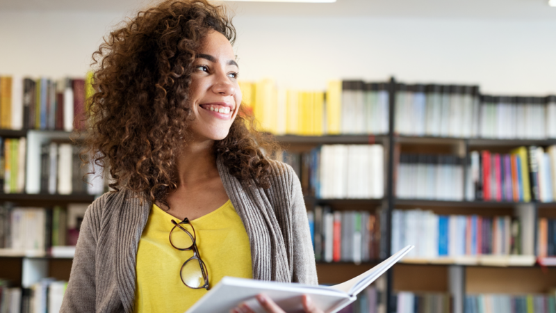 student in library