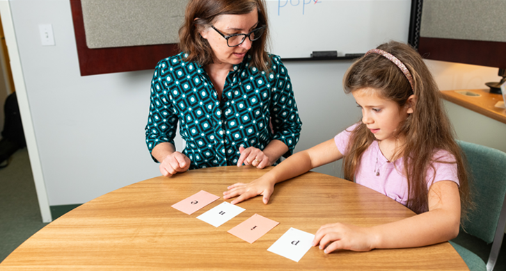 teacher-working-with-girl