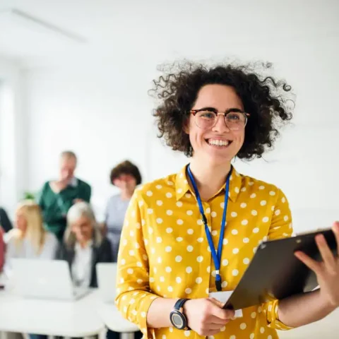 teacher smiling at the camera